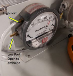 Connecting the pneumatic hose in the positive or high side while leaving low side open to atmosphere or ambient