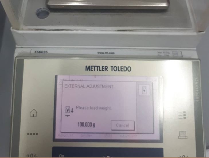 External adjustment on a Mettler Toledo digital balance