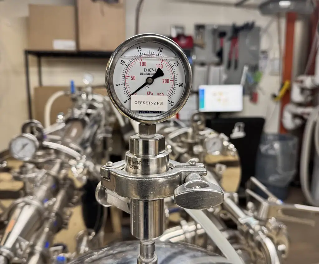 calibrated pressure gauge showing offset value